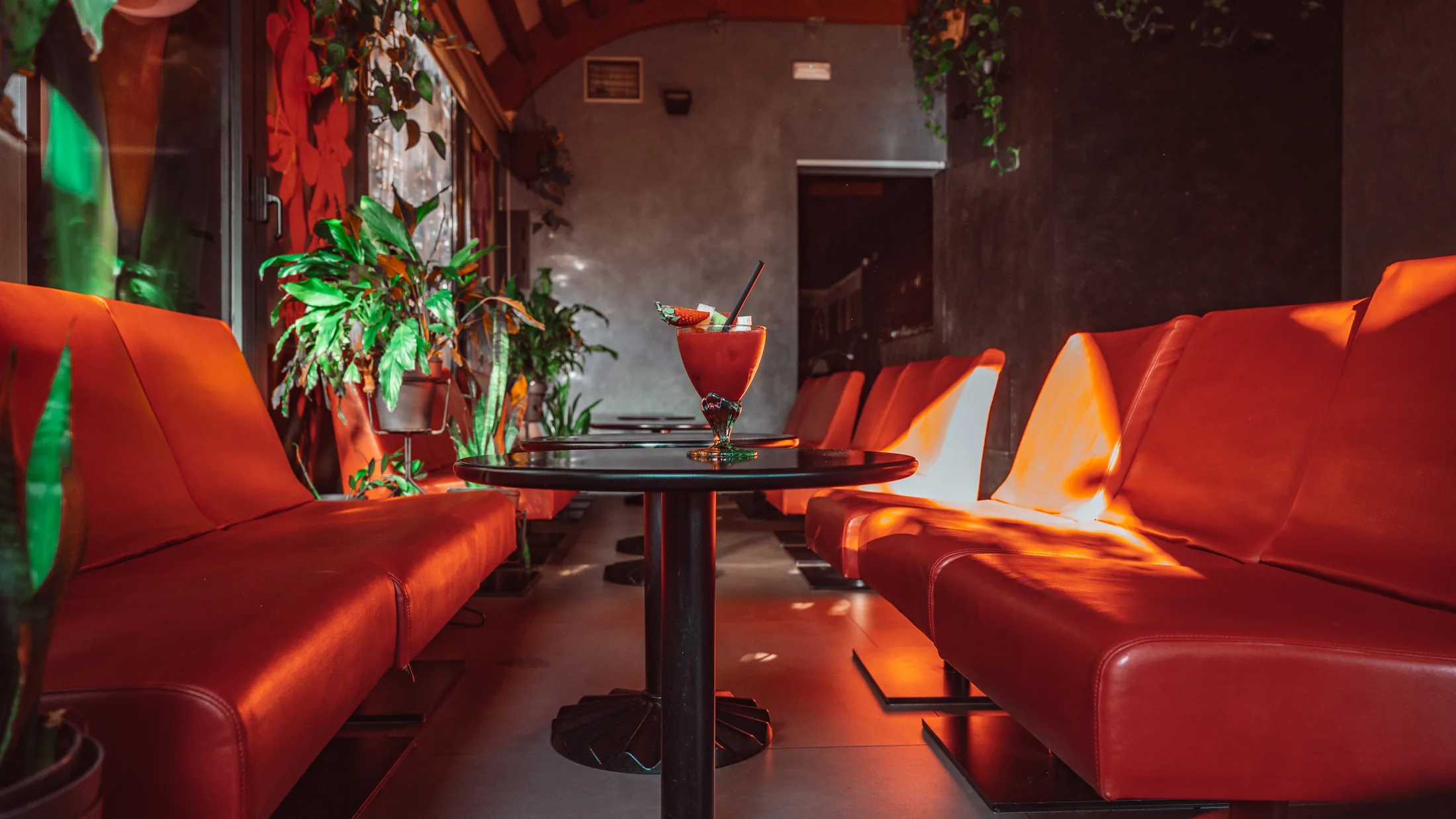 Thouraz Pub lounge with a cocktail